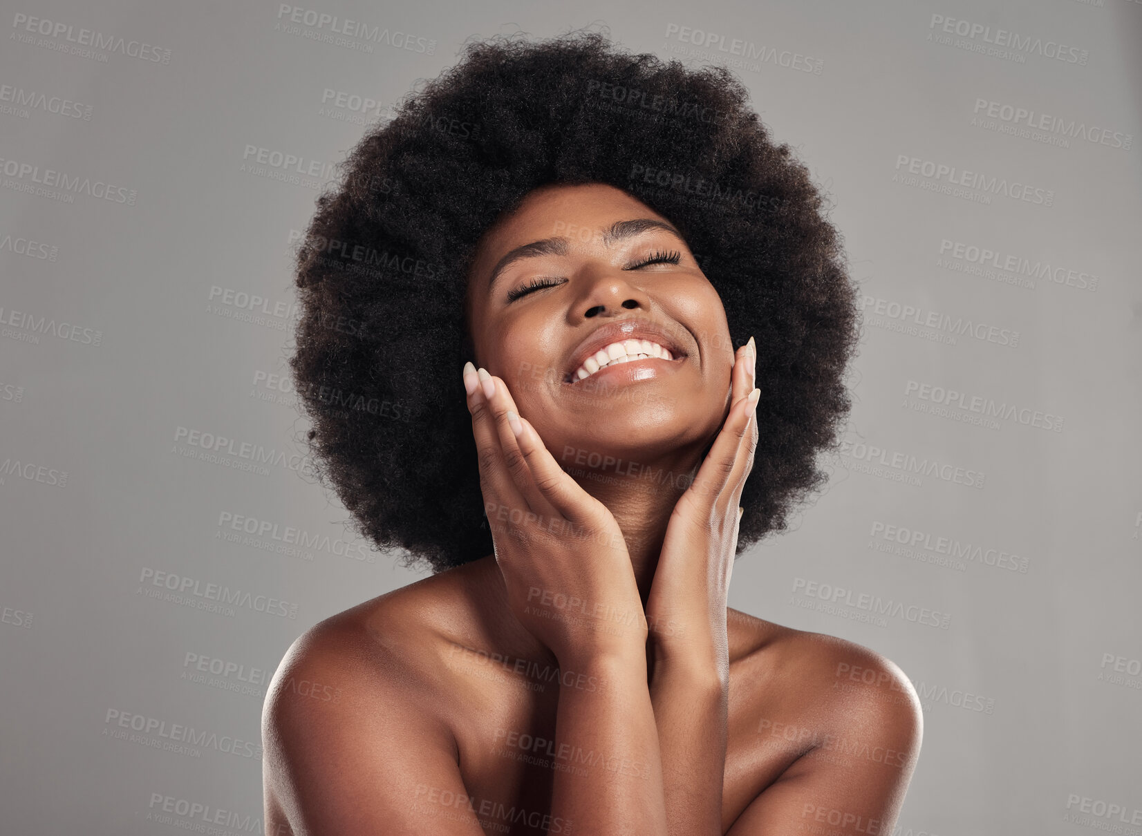 Buy stock photo Beauty, skincare and happiness, black woman with afro and cosmetics in studio on grey background. Natural skin care, dermatology and African model with smile on face, salon makeup glow and wellness.