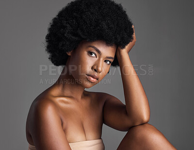 Buy stock photo Natural beauty, serious portrait and black woman with afro, cosmetics and skincare on grey background. Skin care, studio and dermatology, face of African model with salon makeup glow and wellness.
