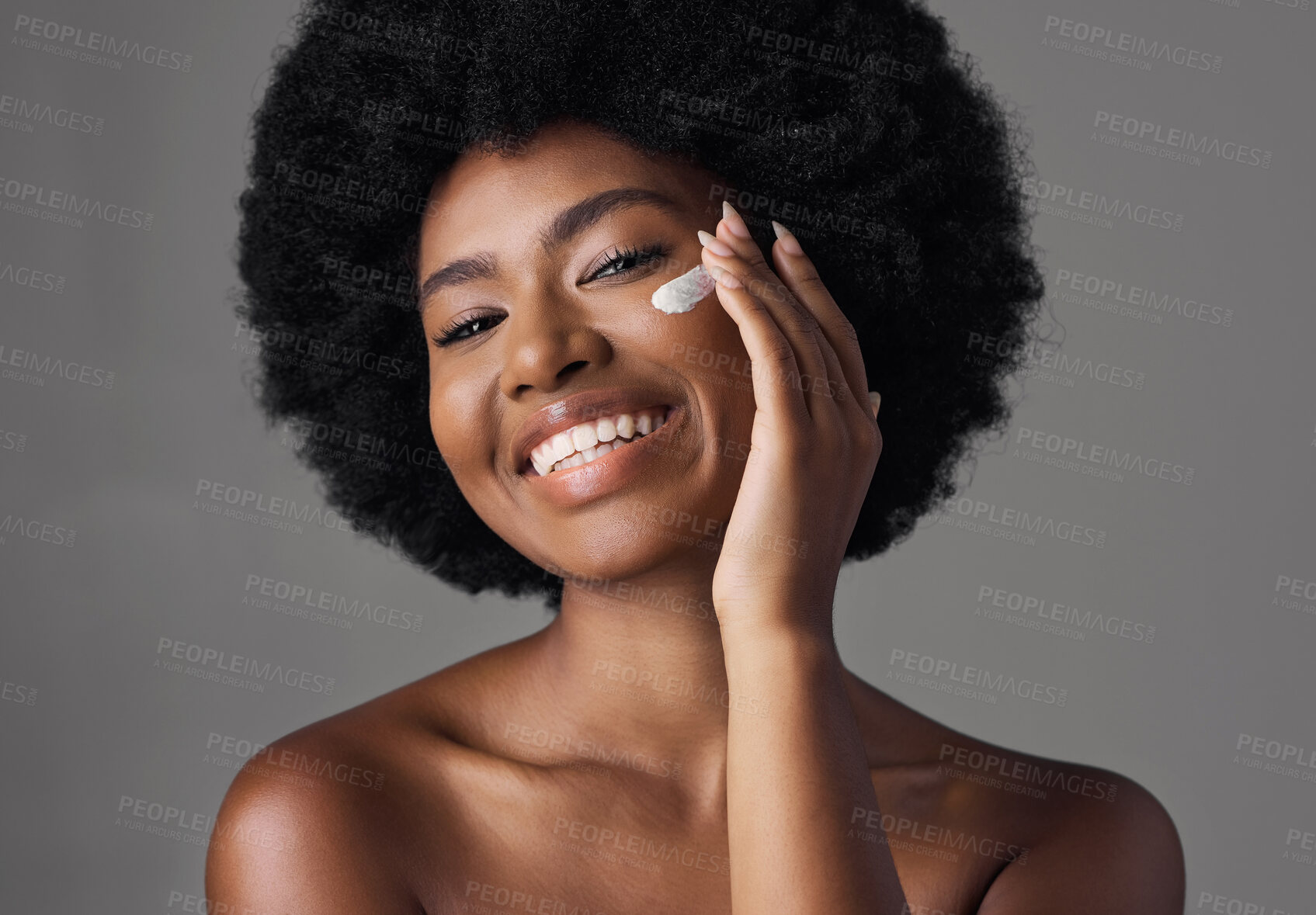 Buy stock photo African woman, skincare cream or studio portrait with afro, face or cosmetic for smile by background. Girl, model and happy for natural self care with makeup, clean aesthetic and product for beauty