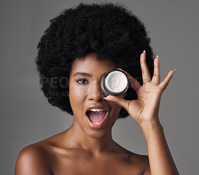 Buy stock photo Black woman, cream and beauty with cosmetics product, skincare and dermatology in portrait on studio background. Natural, afro hairstyle and African female model, lotion and facial moisturizer
