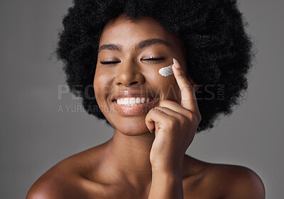 Buy stock photo African woman, skincare cream or smile in studio with afro, face and cosmetics for smile by background. Girl, model and happy for natural self care with health, eyes closed and lotion for beauty