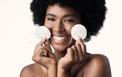Buy stock photo Black woman, cotton pad and beauty, natural cosmetics and skincare with cleaning on white background. Clean makeup from face, wellness and skin glow, African female model with smile and dermatology