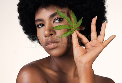 Buy stock photo African woman, leaf and weed in studio portrait for wellness, cosmetics or skincare by white background. Girl, model and hemp for beauty, makeup or natural plant for skin aesthetic, afro and health