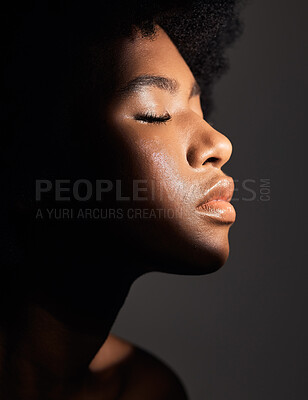 Buy stock photo Face shadow, light and black woman with beauty, natural skincare glow and calm with facial cosmetics routine. Wellness profile, dermatology and African studio person with self care on grey background