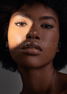 Buy stock photo Shadow, portrait and black woman with beauty light, natural facial makeup and aesthetic skincare shine. Creative studio lighting, cosmetology and African person face with self care on grey background
