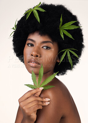 Buy stock photo Woman, leaves and CBD skincare in studio portrait, pride or organic cosmetics by white background. African girl, model or hemp for beauty, makeup or natural glow on skin for aesthetic, afro or health