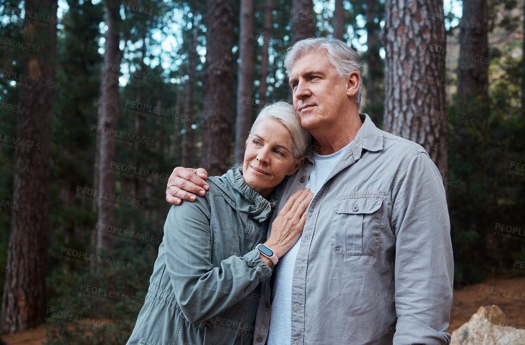 Buy stock photo Hug, hike and senior couple outdoor, fitness and bonding in nature, quality time and happiness outside. Wellness, mature man and old woman in forest, exercise and fresh air for healthy lifestyle