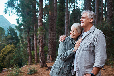 Buy stock photo Hug, hiking and senior couple in forest, workout and quality time outdoor, happiness and wellness. Romance, mature man and old woman in woods, walking and fitness for healthy lifestyle and nature