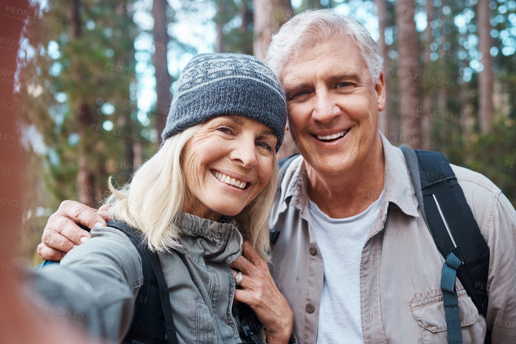 Buy stock photo Old couple, selfie and hiking in forest, happy people in portrait, nature and memory for social media post. Smile in picture, adventure and fitness, man and woman with active retirement and outdoor