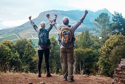 Buy stock photo Hiking, mature couple and arms raised on cliff from back on nature walk and mountain in view in Peru. Travel, senior man and woman celebrate forest hike with love and achievement on holiday adventure