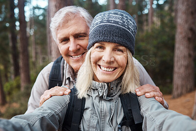 Buy stock photo Senior couple, selfie and portrait, hiking in forest and happy people in nature and memory for social media post. Smile in picture, adventure and fitness outdoor, man and woman with active lifestyle