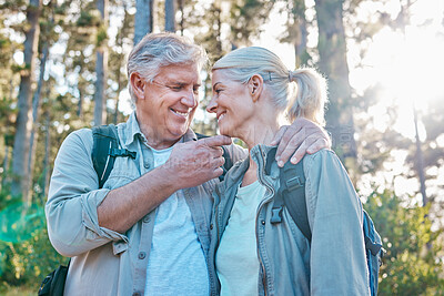 Buy stock photo Love, nature and senior couple on a hike together in a forest while on outdoor weekend trip. Happy, intimate moment and elderly man and woman in retirement trekking in woods to explore and adventure.