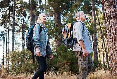 Buy stock photo Forest, retirement and hiking, mature couple with backpack on nature walk and mountain path in USA. Travel, senior man and woman on exercise hike with love, health and trekking on holiday adventure.