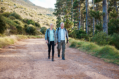 Buy stock photo Forest, path and hiking, old couple on nature walk with backpack in mountains path in Canada. Travel, senior man and mature woman on exercise hike with love, health and trekking on holiday adventure.