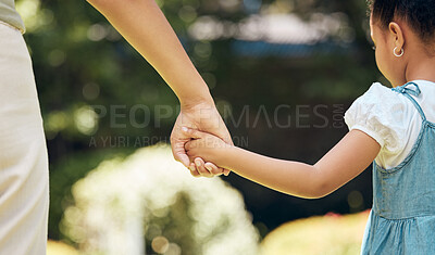 Buy stock photo Holding hands, back and girl with mother outdoor, walking and bonding together. Hold hand, mom and child in nature to walk, travel and journey with care, safety and security, support or trust to help
