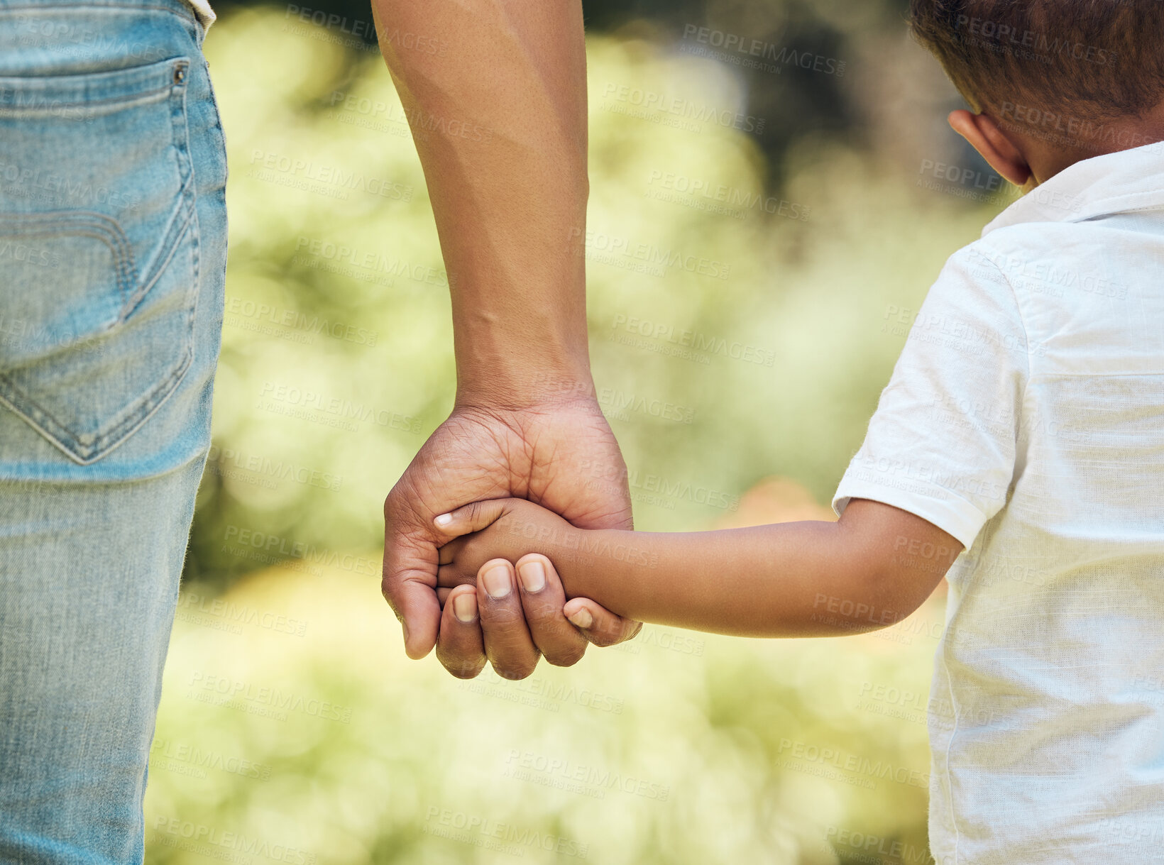 Buy stock photo Holding hands, back and kid with father outdoor, walking and bonding together. Hold hand, dad and child in nature to walk, travel and journey with care, safety and security, support or trust to help.