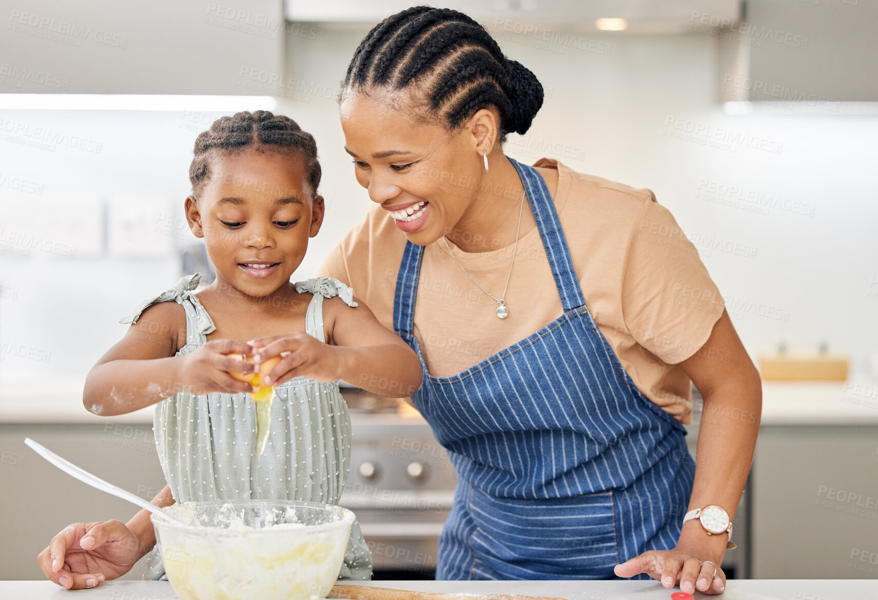 Buy stock photo Black family, mother and child together for baking at kitchen counter with help and love. African woman or mom and happy kid in a house cooking food, dessert and pancakes for learning and development