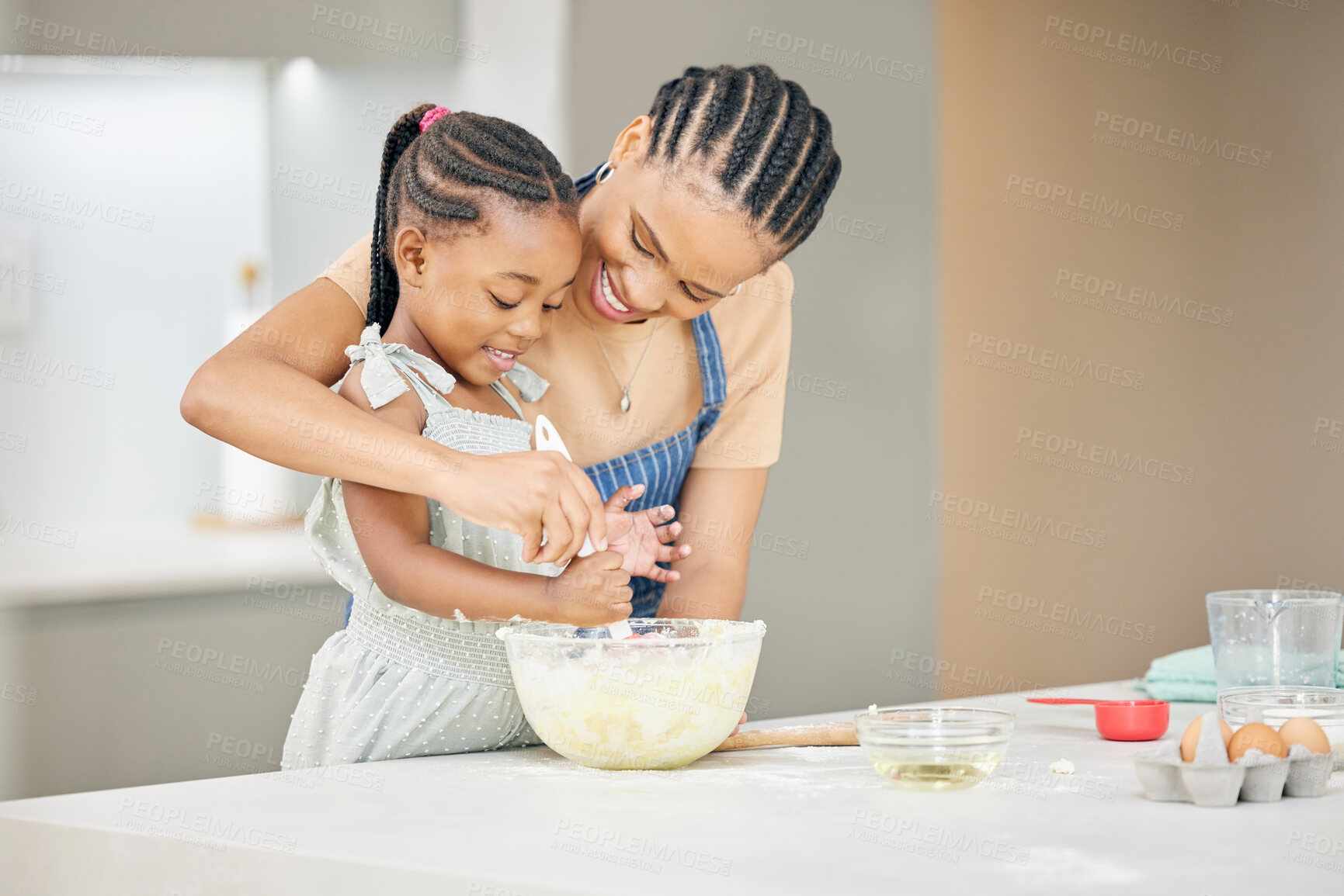 Buy stock photo Black child, mother or family baking together at kitchen counter for help and development. African woman or mom and girl kid in happy home to learn about cooking food, dessert and pancakes with love