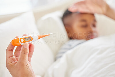 Buy stock photo Shot of an unrecognisable mother using a thermometer to check her sick child's temperature at home