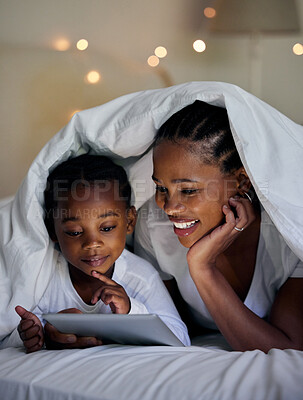 Buy stock photo Black family, relax and tablet in home at night, online and app for playing games for love. Mother, daughter and blanket for fort or watching cartoon in bedroom, streaming and rest together in bed