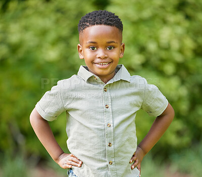 Buy stock photo Boy, portrait and smile with hand on hip in the outdoor for fun and sunshine in africa. Male kid, smile and hands on hips in nature with sun with confidence for relaxation and a happy weekend.
