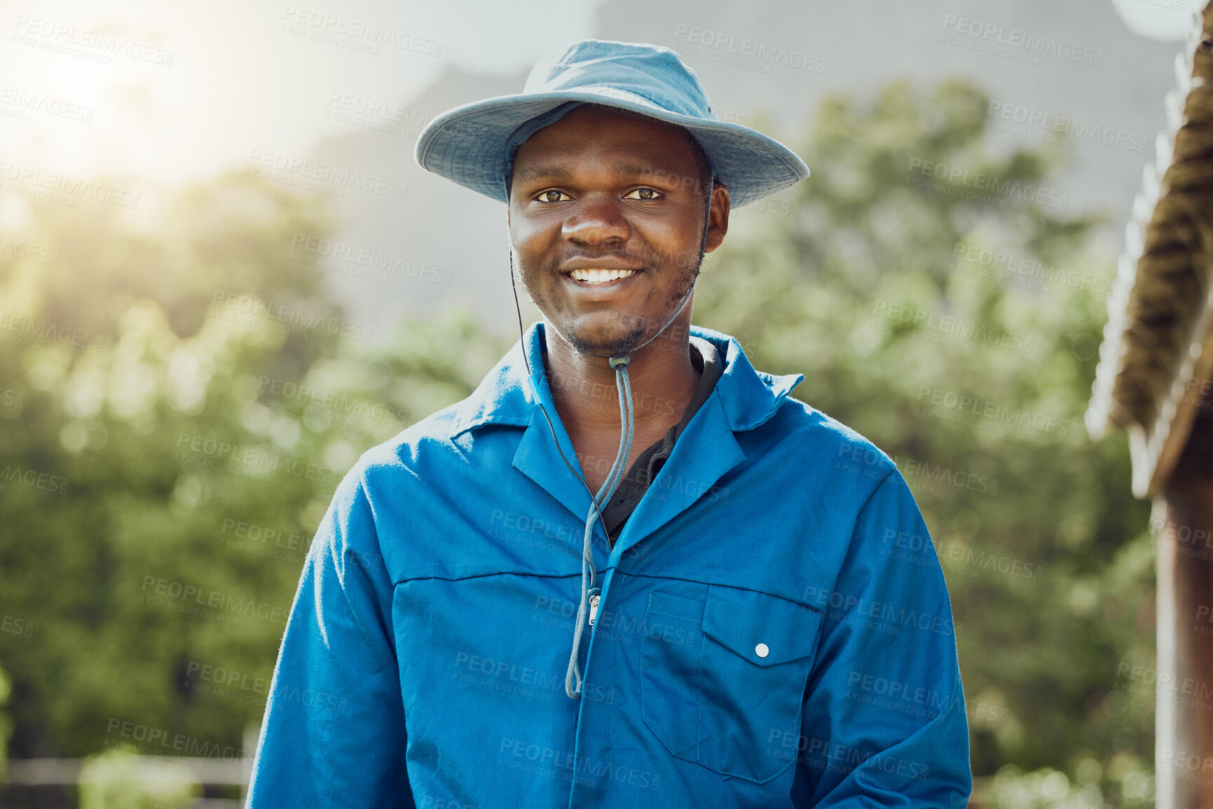 Buy stock photo Happy, portrait or black man with hat on farm for agriculture, conservation or natural production in nature. Young African, male person or farmer with smile for produce, crops or gardening in Nigeria