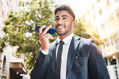 Buy stock photo Cropped shot of a handsome young businessman making a phonecall while out in the city