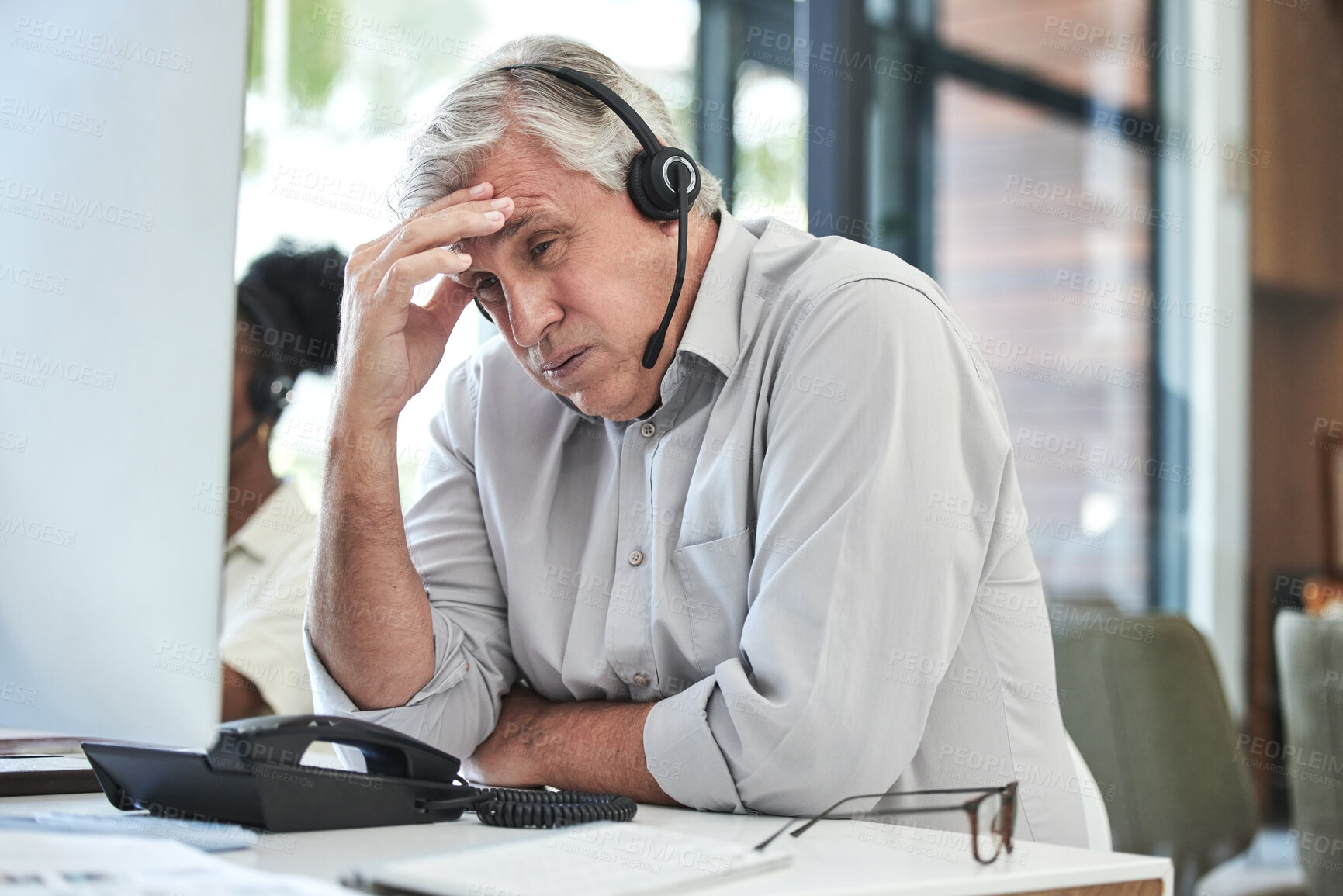 Buy stock photo Stress, telemarketing manager and man with headache in customer service agency with pain or crisis. Communication fail, senior management with computer or help desk consultant with problem phone call