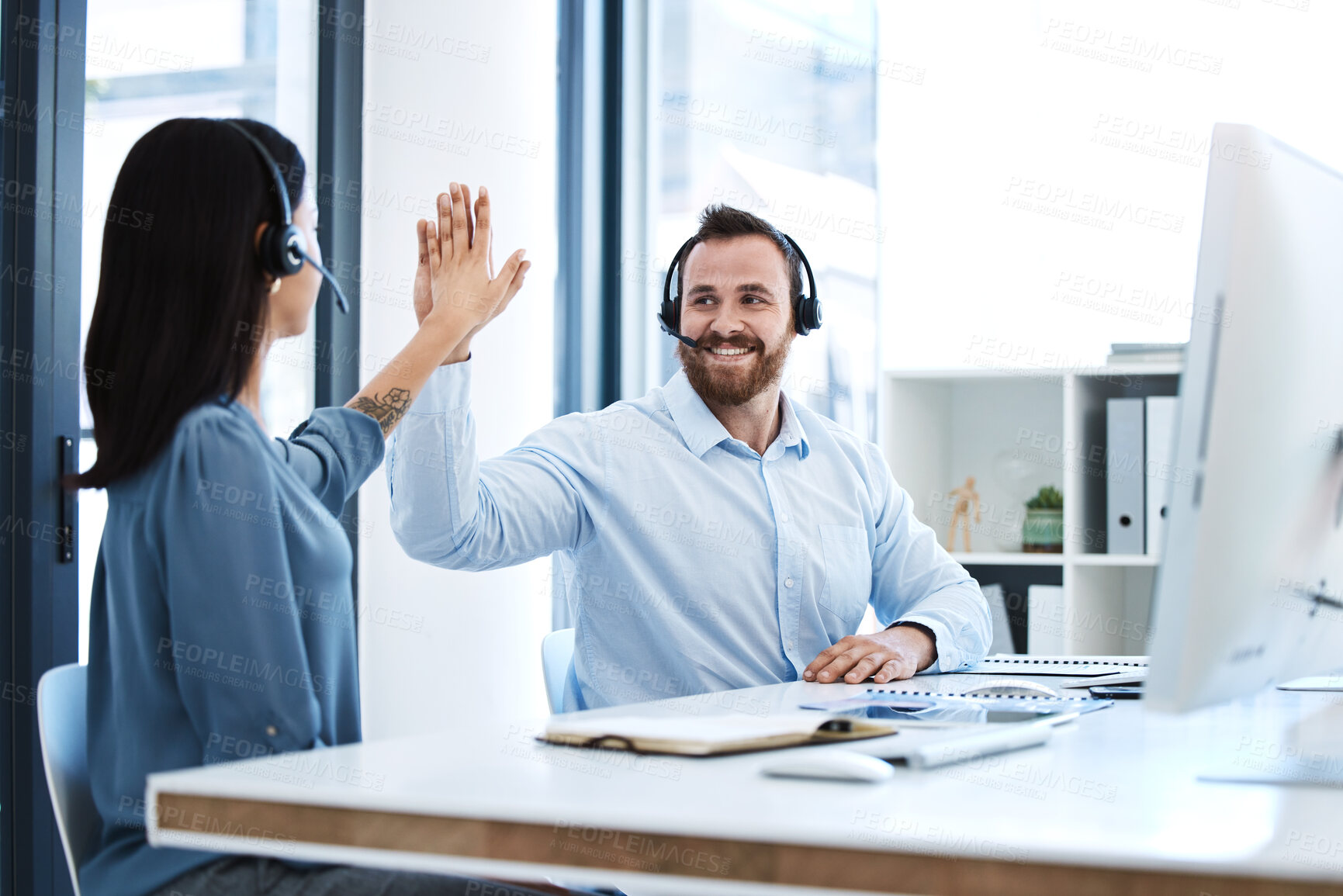 Buy stock photo High five, callcenter team and contact us, phone call success and people celebrate in office. CRM, communication and solidarity in customer service, man and woman help desk consultant with motivation