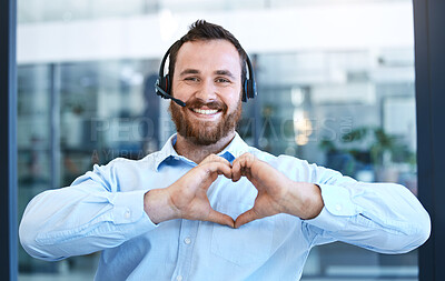 Buy stock photo Callcenter agent, man with smile and heart hands in portrait, love customer service job and feedback. Hand gesture, care emoji and male consultant is happy with job at contact center and tech support