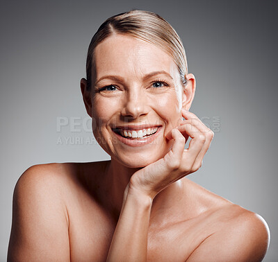 Buy stock photo Beautiful mature woman posing in studio against a grey background