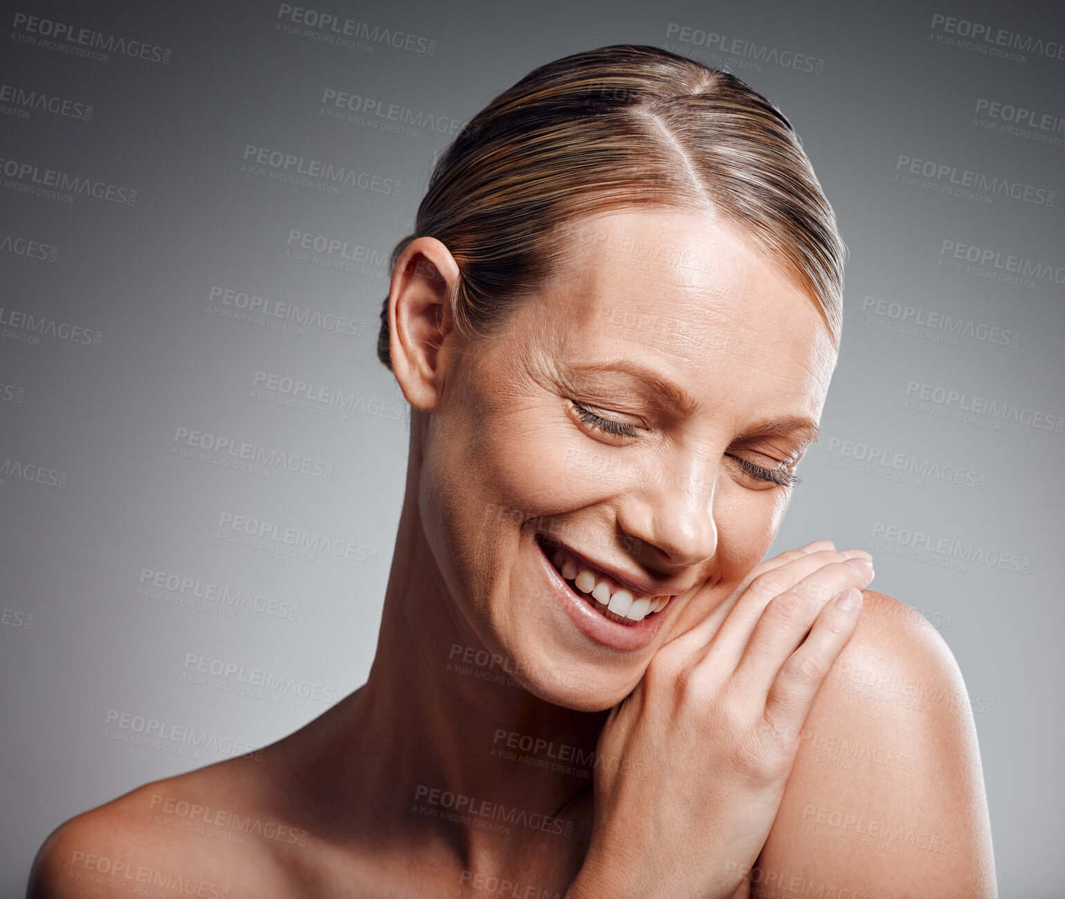 Buy stock photo Beauty, hand and shoulder of mature woman in studio on gray background for facial cosmetics. Face, skincare and smile with happy model person at salon or spa for antiaging dermatology treatment