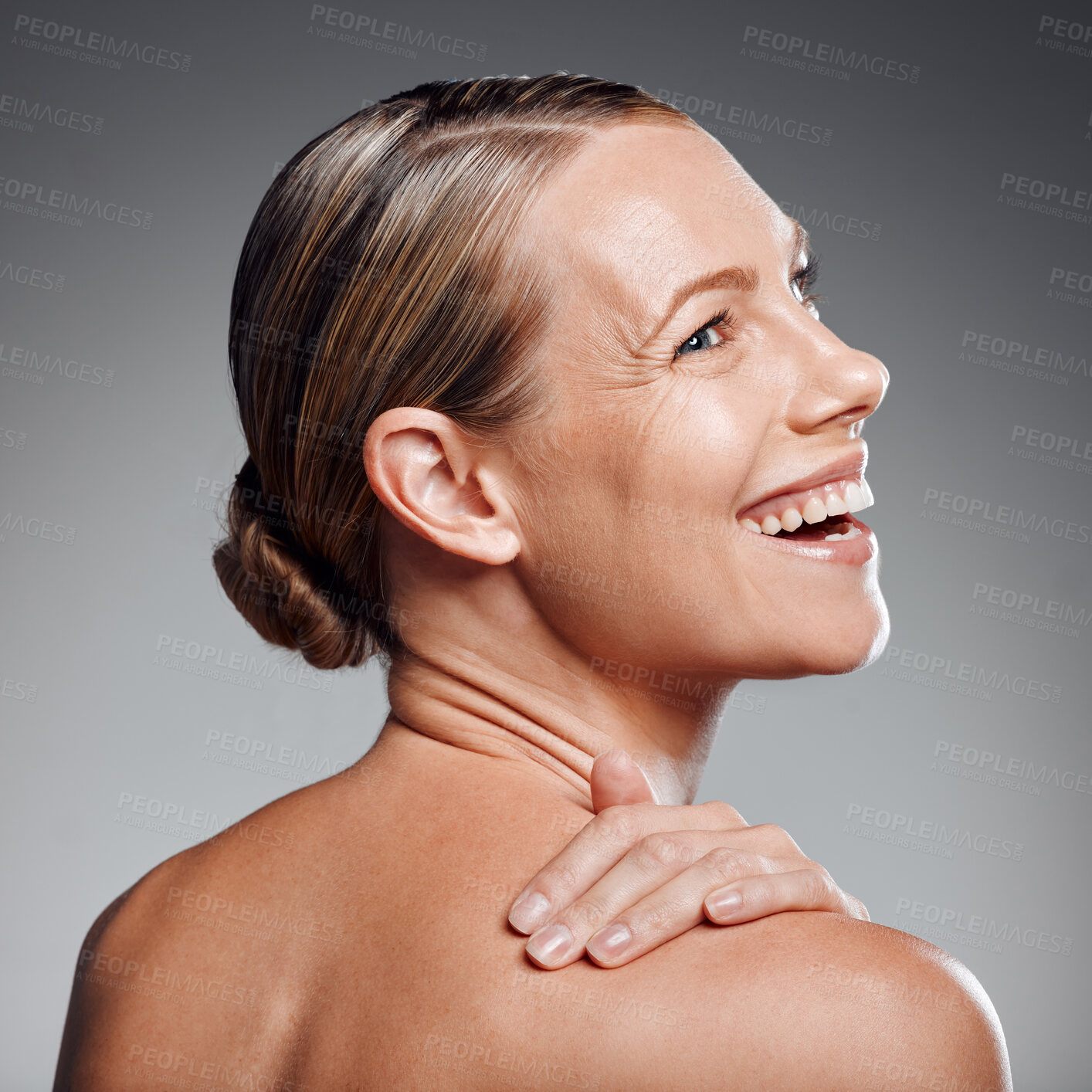 Buy stock photo Back, beauty and laughing with mature woman in studio on gray background for facial cosmetics. Funny, happy and skincare with person having fun at salon or spa for antiaging dermatology treatment