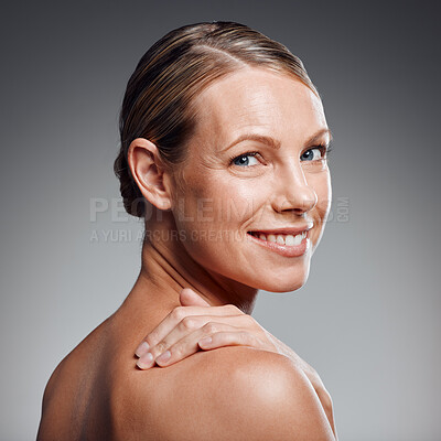 Buy stock photo Beauty, hand and portrait of mature woman in studio on gray background for facial cosmetics. Face, skincare and wellness with smile of person at salon or spa for antiaging dermatology treatment