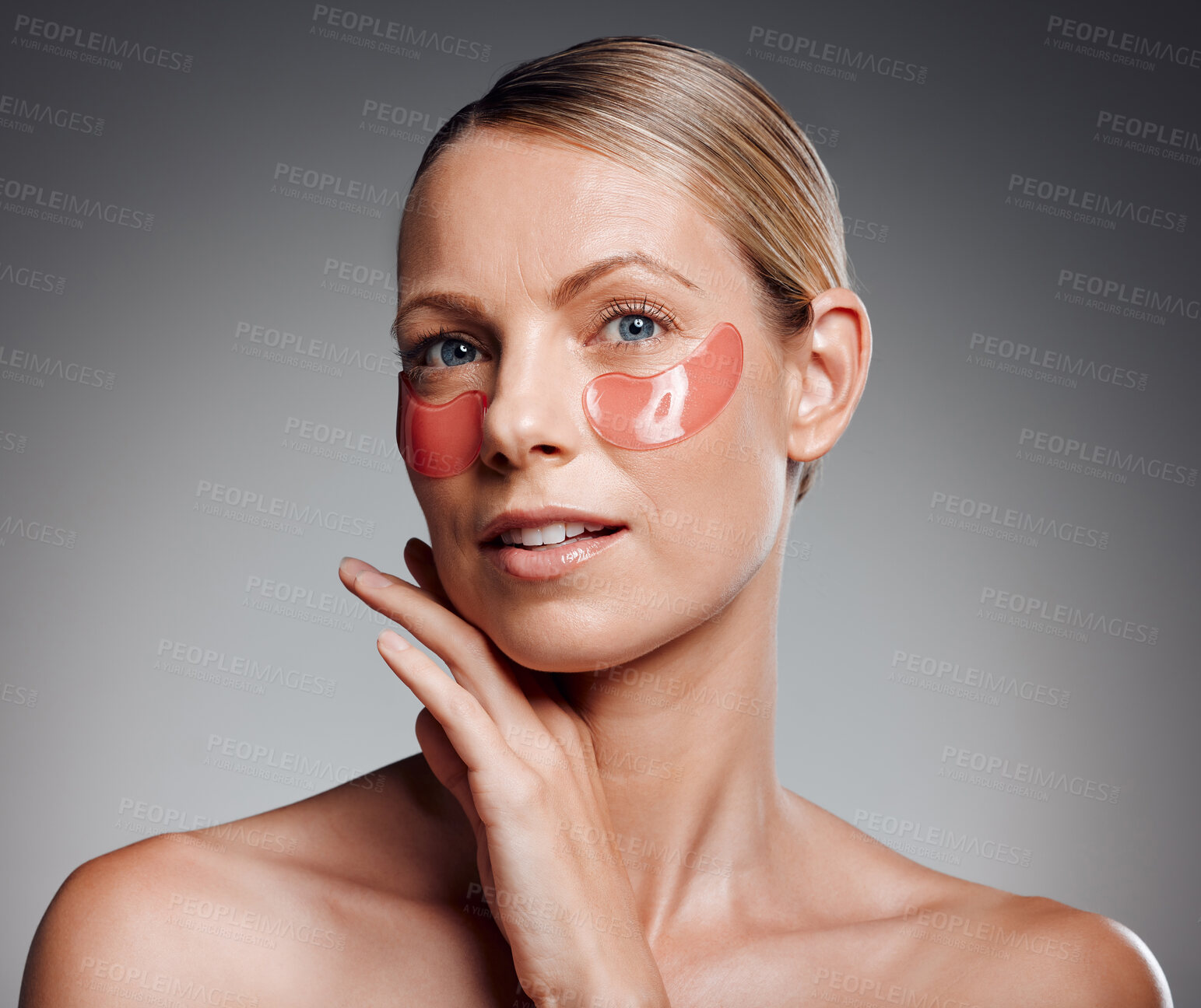 Buy stock photo Portrait, woman and eye patches for skincare, wellness or collagen treatment for beauty. Mask, mature model or cosmetics on face for dermatology, glow or anti aging isolated on gray studio background