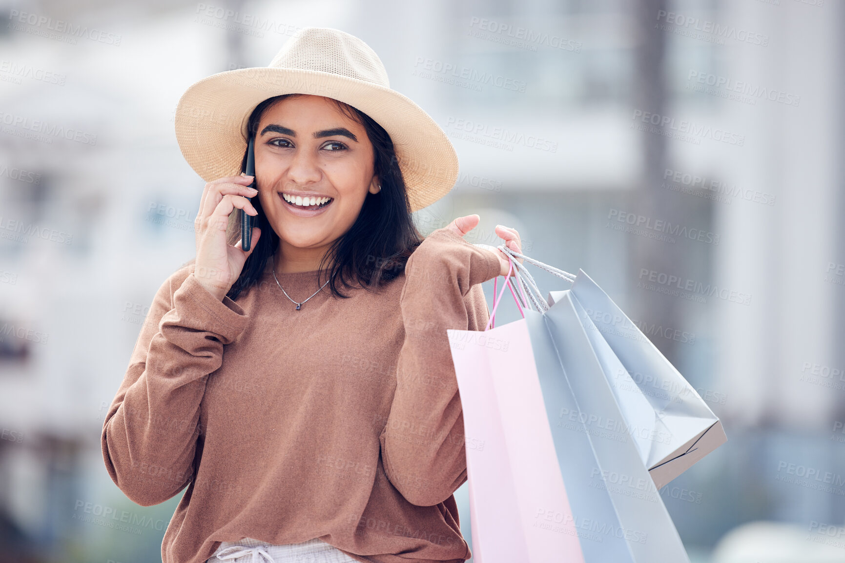 Buy stock photo Shopping, phone call and Indian woman in city with bag for communication, conversation and chat. Retail, fashion and happy female person talking on smartphone with sale, bargain and discount purchase