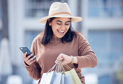 Buy stock photo Shopping, time and Indian woman with phone in city with bag for adventure, rushing and hurry. Retail, fashion and female person check watch with bags from sale, bargain and discount purchase in town