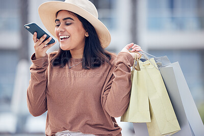 Buy stock photo Shopping, voice note and happy Indian woman in city for communication, conversation and chat. Retail, fashion and female person talking on smartphone with bags for sale, bargain and discount purchase