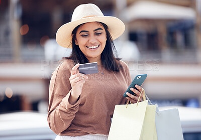 Buy stock photo Woman, smile with credit card and smartphone, shopping bag at mall with online payment and fintech. Happy female customer at outdoor market, ecommerce with bank app and internet banking transaction