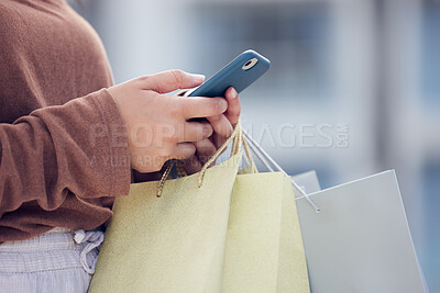 Buy stock photo Shopping, phone and hands of woman in city with bag online for bargain notification, social media and internet. Retail, fashion and female person on smartphone for chat, mobile app and website sale