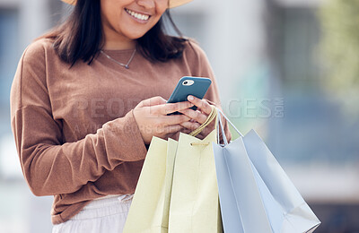 Buy stock photo Shopping, phone and woman typing in city with bag online for sale notification, social media and internet. Retail, fashion and happy female person on smartphone for chat, mobile app and website sale