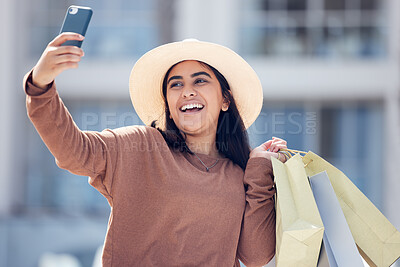 Buy stock photo Shopping, selfie and happy Indian woman in city with smile for online post, social media and internet. Retail, fashion and female person take picture with bags from bargain, sale and discount in town
