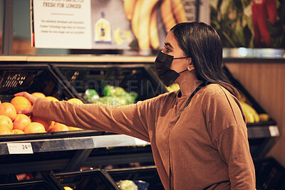 Buy stock photo Grocery shopping, woman and fruit at a retail shop, market and store for groceries with mask. Health, virus safety and female person with orange and healthy food purchase in a supermarket at shelf
