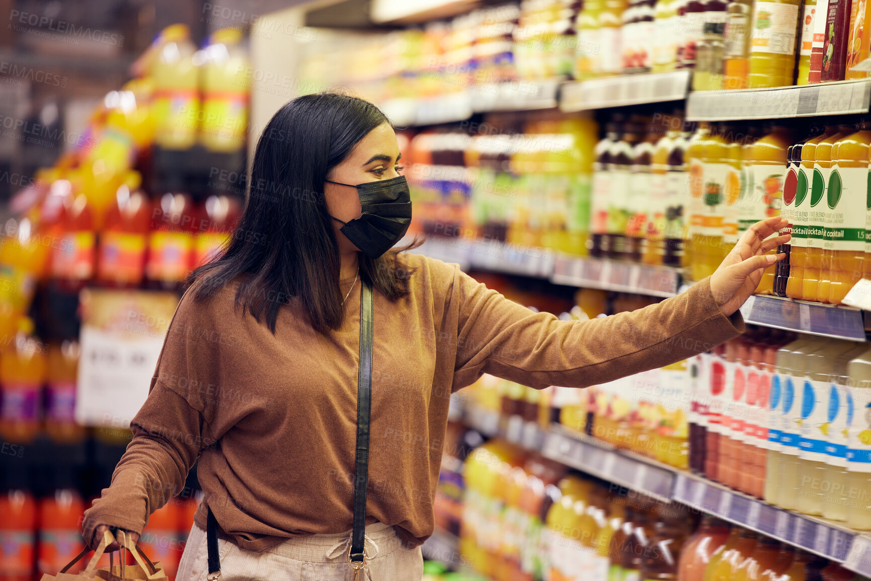 Buy stock photo Grocery shopping, woman and juice at a shop, market and store for groceries sale with mask. Health, virus safety and female person with orange and healthy drink purchase in a supermarket at shelf