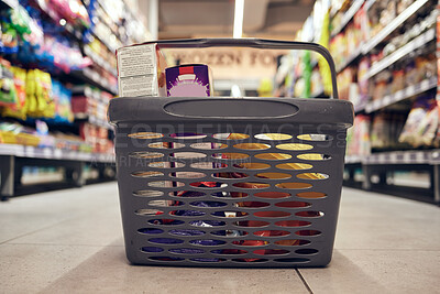 Buy stock photo Closeup of basket with groceries, floor with shopping and supermarket, food product with retail and stock. Grocery choice, store shelf and aisle with merchandise, commercial service with shop sale