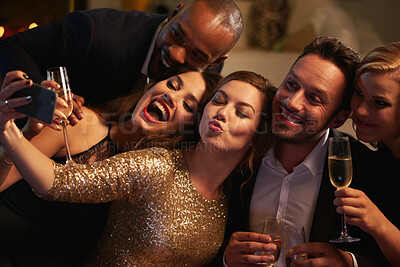 Buy stock photo Selfie, party and new year with friends in a club posing for photograph of celebration together. Champagne, toast and nightlife with a group of people taking a picture in a nightclub while dancing