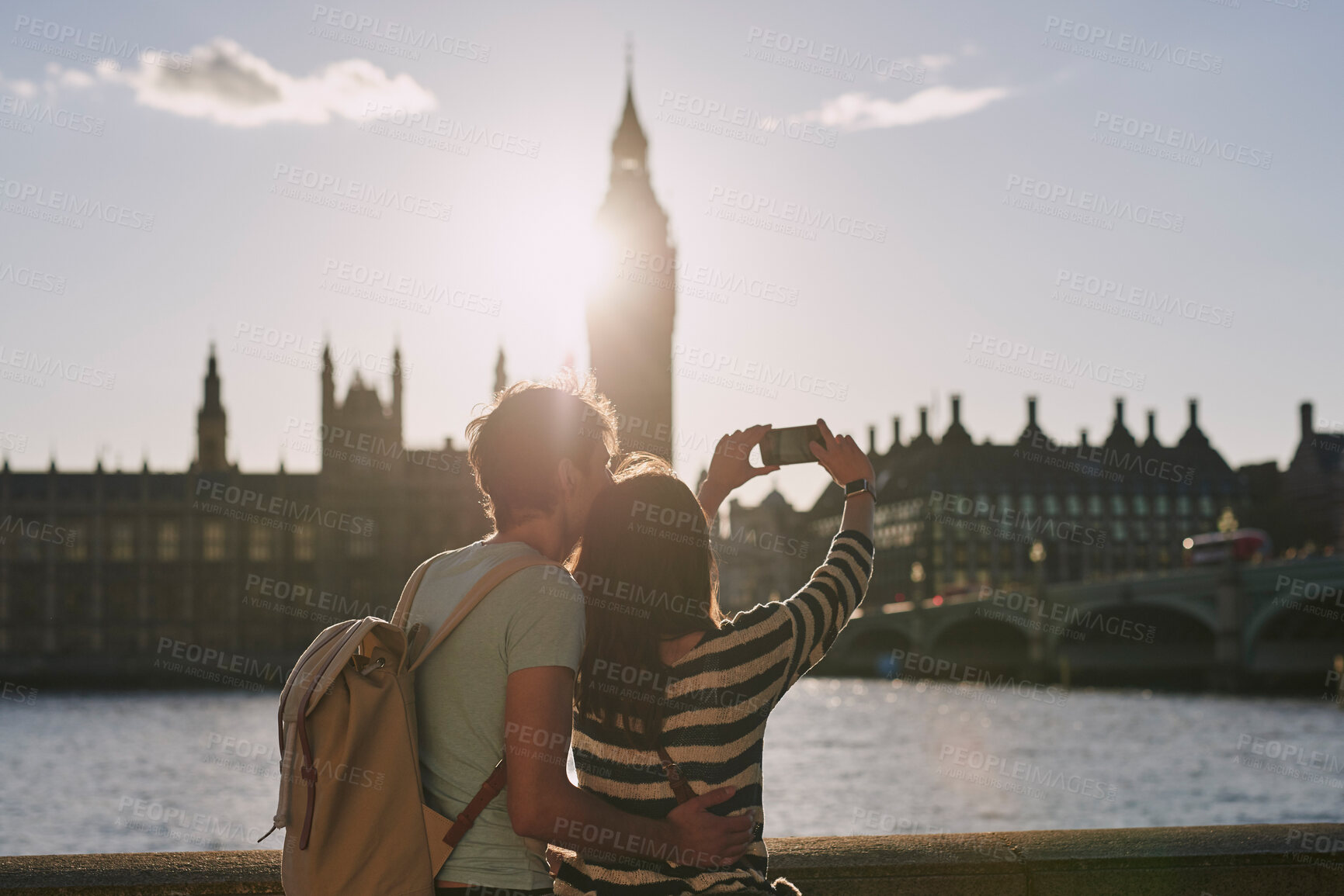 Buy stock photo Phone, selfie and couple by the big ben in London on vacation, adventure or holiday together. Travel, building and young tourist man and woman taking a picture on a smartphone in the city in England.