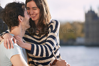 Buy stock photo Love, travel and happy with couple in London for adventure, vacation and destination. Affectionate, hug and smile with man and woman in city at river thames for holiday, embrace and abroad trip