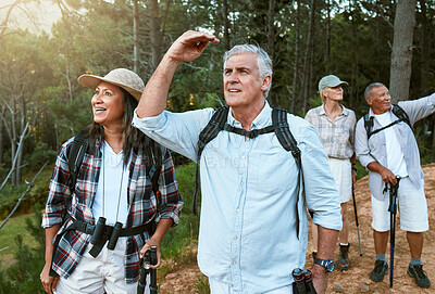Buy stock photo Hiking, adventure and exploring with a group of senior friends having fun, exercising and enjoying the outdoors. Walking, discovery and journey with old people sightseeing in the forest or woods