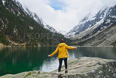 Buy stock photo Outdoor, walking and back of person, lake and view of scenery, adventure and tourist in winter and mountain. Water, snow and vacation in nature, travel and tourism in environment, forest and Canada